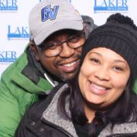 husband and wife in photo booth